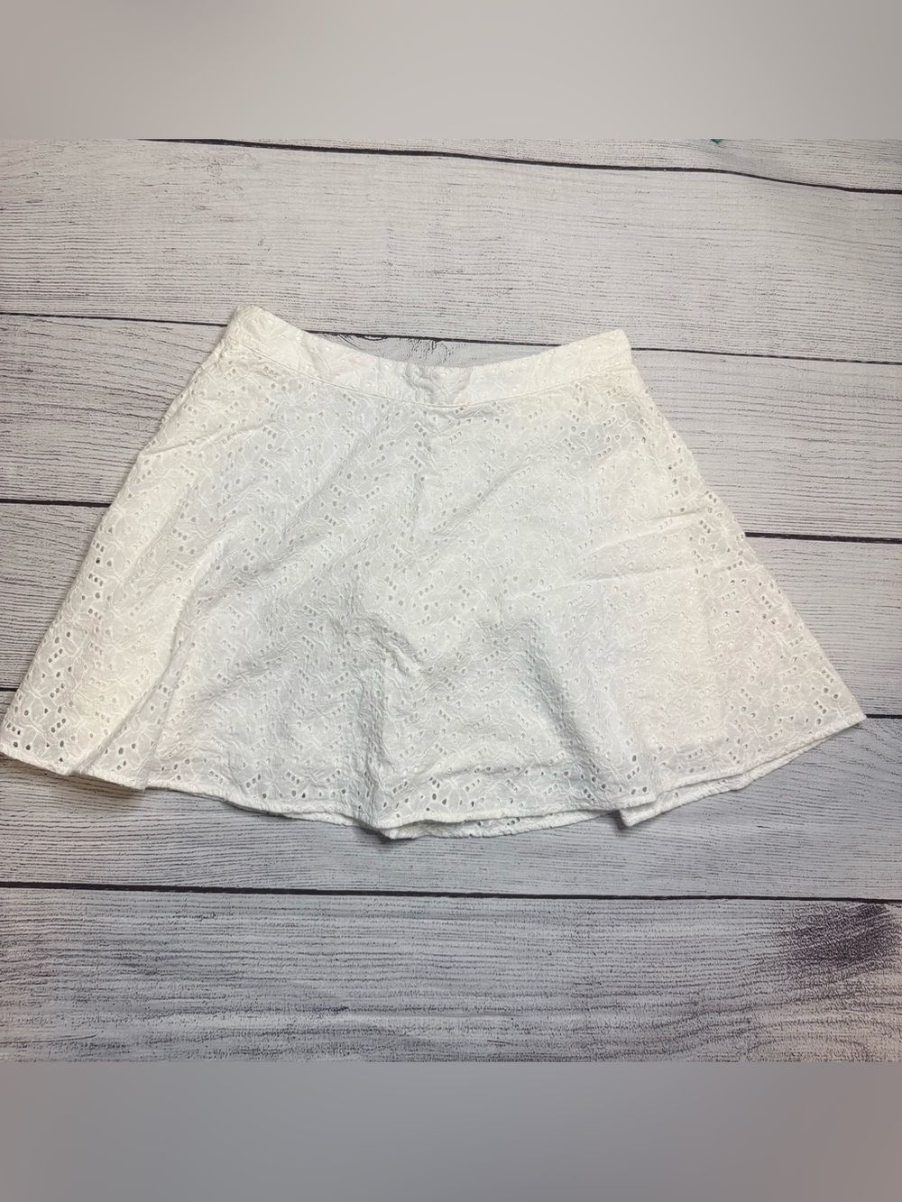 Short white eyelet lace skirt